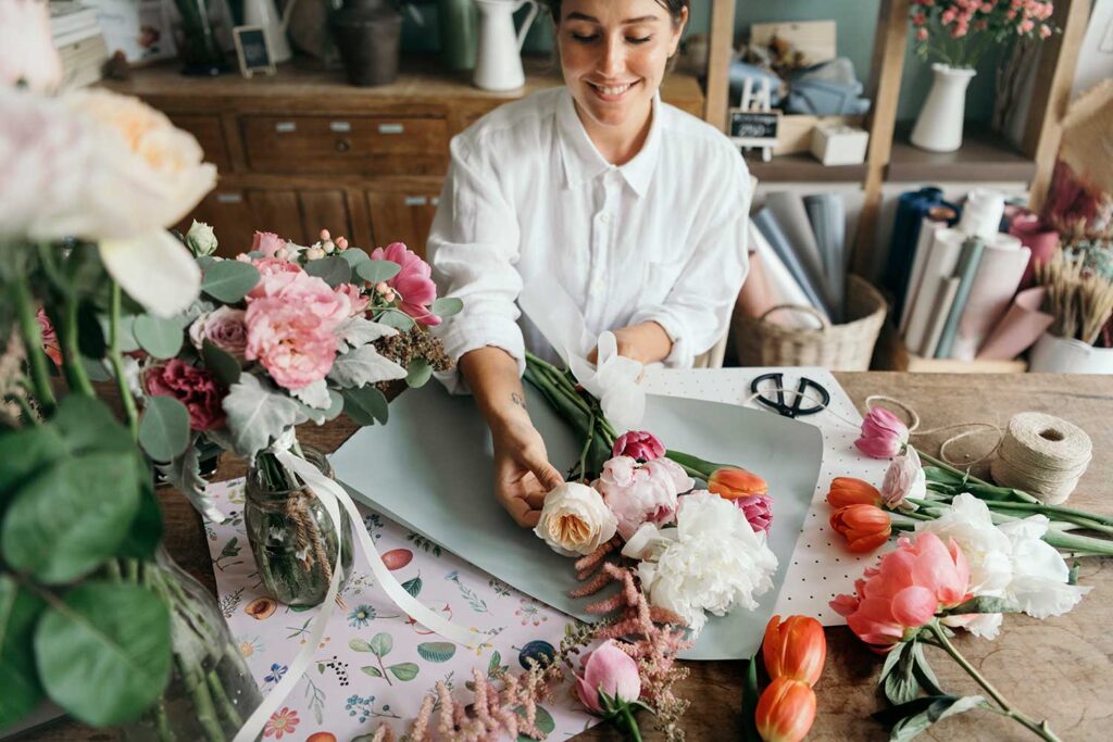 Florist Arranging A Bouquet Of Flower